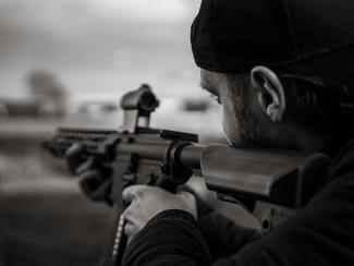 person holding a sniper rifle