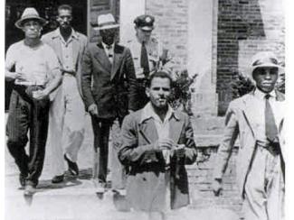 group of white men escorting sam 