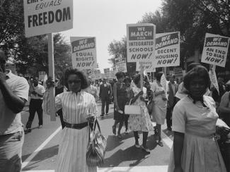 process of african americans carrying signs for equal rights 