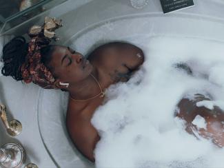 black woman taking a bath