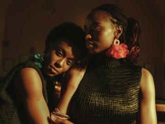 a couple of women sitting next to each other