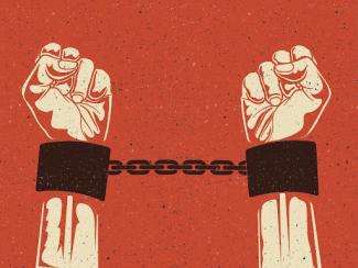 a persons hand ins trained steel handcuffs