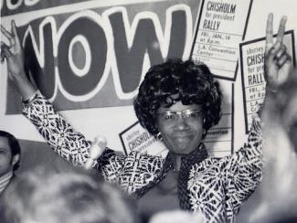 shirley chisholm making the peace sign on both hands