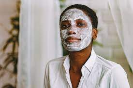 woman with a bleaching cream on face
