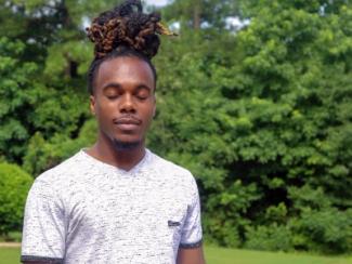 black man closing his eyes 