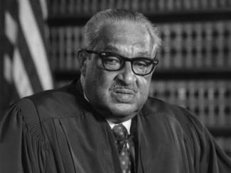 black and white photo of thurgood marshall in supreme court justice robes