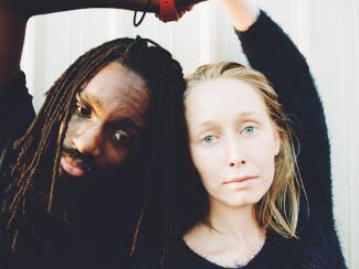 black and white woman close together