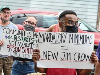 people holding protest signs