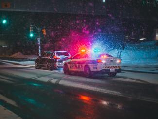 police car pulling over a vehicle