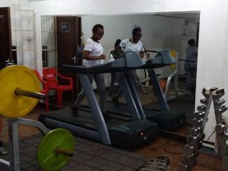 black woman exercising on a treadmill 
