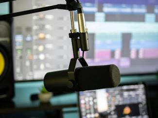 black and gray microphone with stand