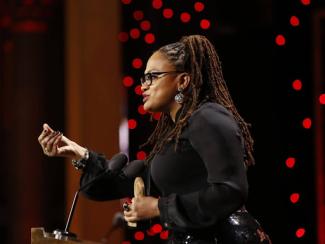 ava duvernay speaking at a podium