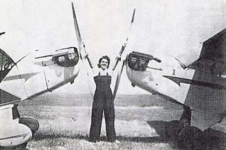 willa brown standing in between two planes