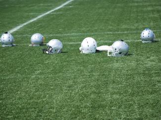 football helmets laying on the field