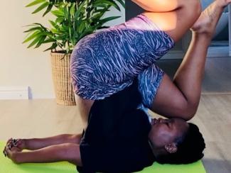 person doing a yoga pose on a yoga mat
