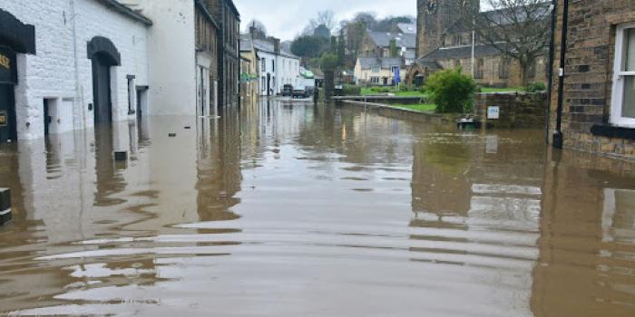flooded town under blue sky and white clouds