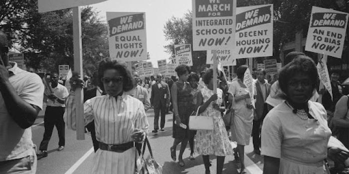 process of african americans carrying signs for equal rights 