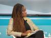 karen attiah sitting down in a chair
