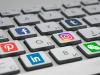 keyboard with different social media logos attached