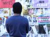 protest signs attached to a fence