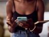 close up view of african american womans hands with smartphone 