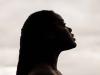 silhouette of black woman staring off in the distance