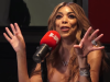 wendy williams sitting in front of a mic
